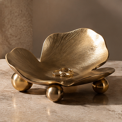 Gold flower petal metal tray with rings — clean plain background