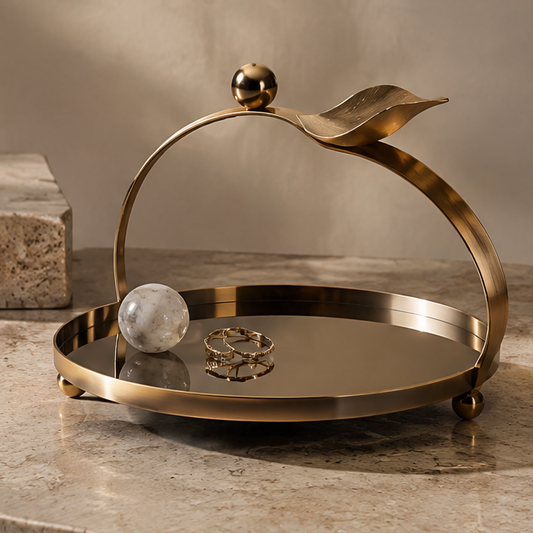 Gold arch handle round mirror tray with marble ball and rings — clean background