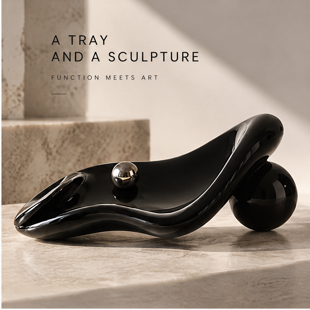 Black organic tray on stone surface — A Tray and a Sculpture