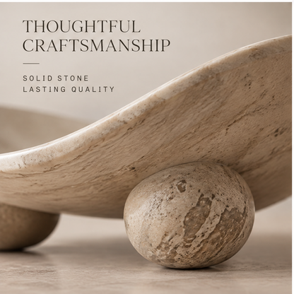 Close-up of stone ball feet and travertine texture — Thoughtful Craftsmanship