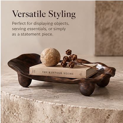 Wavy-edge footed organic wood tray with walnuts — plain background